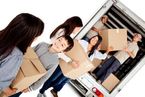 House removals planning in Swisscottage with moving boxes and a residential street