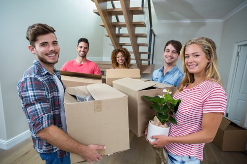 Stacked packing boxes and moving supplies in Swisscottage