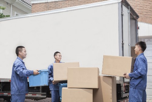 Organized moving boxes and equipment inside a removal truck