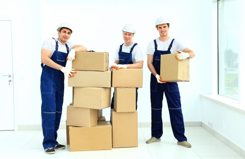 Team organizing moving boxes during a Swisscottage relocation