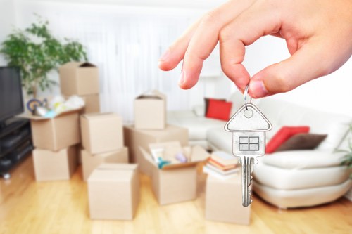 Professional team loading a removal van in Swisscottage