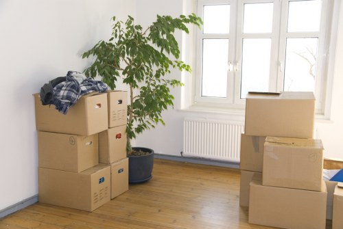 Professional movers loading furniture for same day removals in Swisscottage