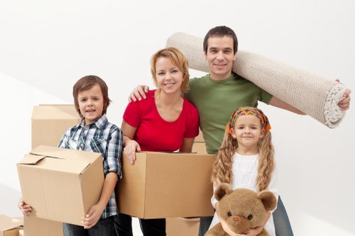 Packed boxes and furniture prepared for removals in Swisscottage