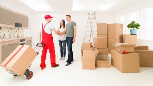 Unpacking items into a new apartment in Swisscottage