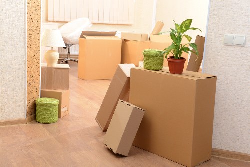 Removal team estimating cubic-yard volume for household items