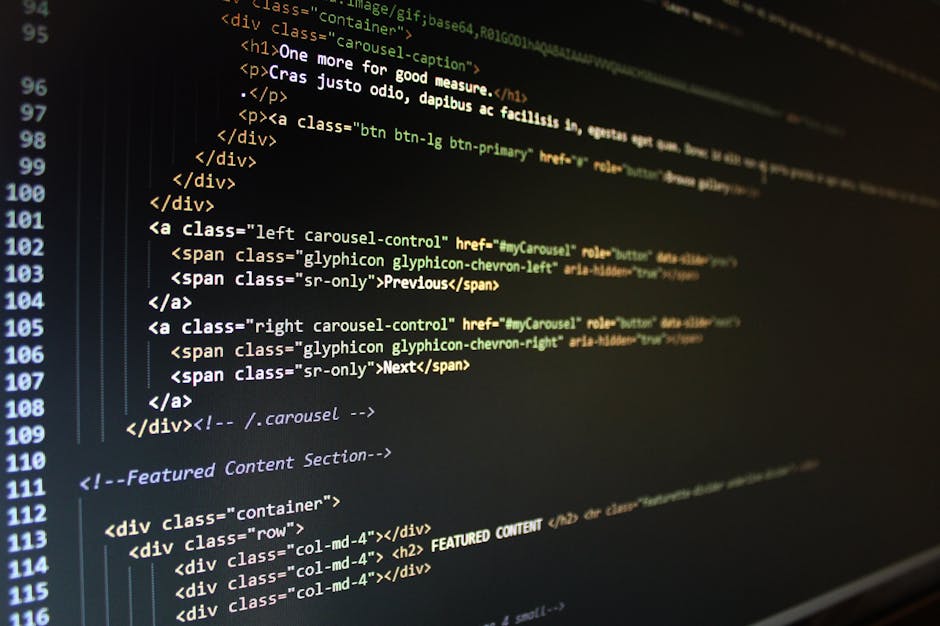 Close-up image of a computer screen displaying colorful lines of code with syntax highlighting, including keywords, variables, functions, and operators in various colors such as red, green, yellow, an